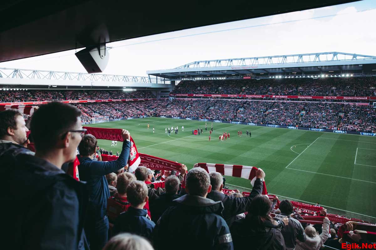 Fans raising the banner high after Liverpool wins 2-0 against Totten ham FC