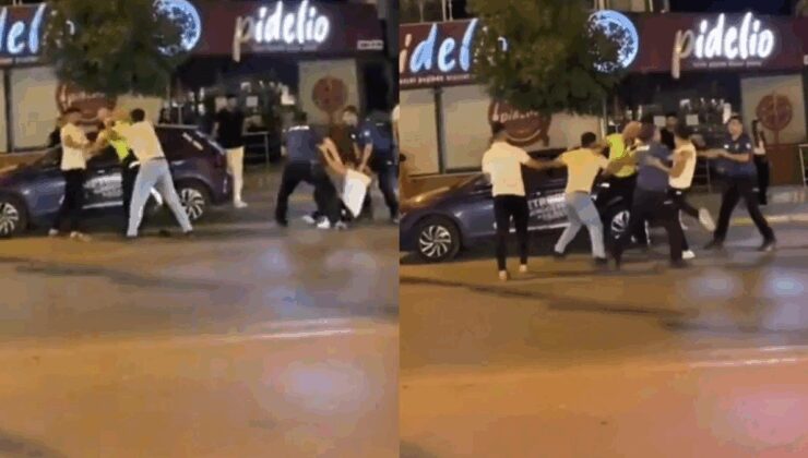 İzmir’in göbeğinde şehir eşkıyaları kendilerine ceza yazan trafik polisine tekme tokat saldırdı!