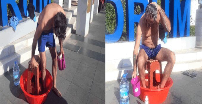 Susuzluğu protesto için belediye meydanında soyunup yıkandı