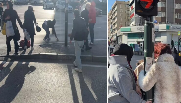 Fırtınada zor anlar: Uçmamak için trafik direğine tutundular