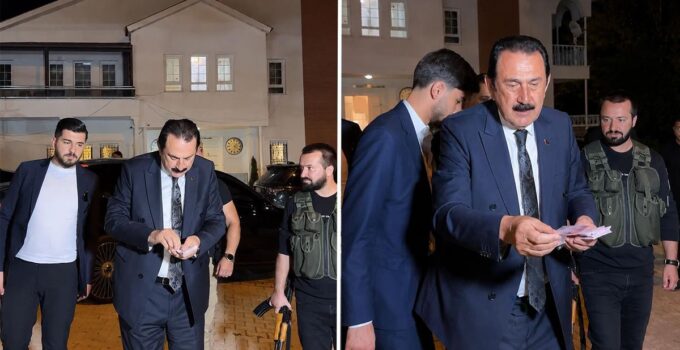 Ertoşi aşiretinin lideri İskender Ertuş aracından iner inmez deste deste para dağıttı